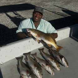 Successful redfish catch displayed on boat deck in Port Arthur TX