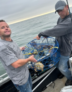Two people enjoying a fishing trip in Gold Hill