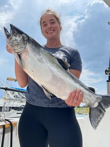 Angler holding a large sea trout fish caught in WI