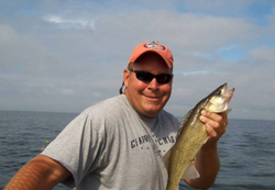 A lone fisherman casts his line in MI