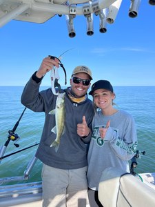Angler holds a sauger fish caught in Ludington