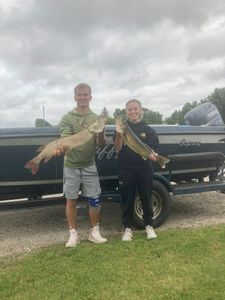 Three people fishing in Ludington