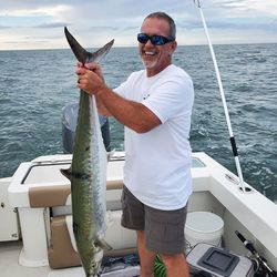 A fisherman with a large King Mackerel catch in NC