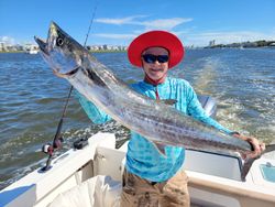 Fisherman holding a big 36-inch catch in Hampstead