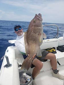 A person fishing on the Florida coast