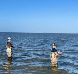 Two fishermen standing in TX