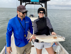 A fisherman catching a redfish in Matagorda