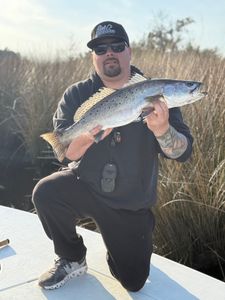 1 fisherman catching a big fish in NC
