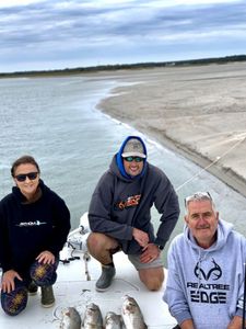 3 people fishing with 1 small fish in NC