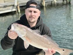Fisherman in NC holding a 21-inch catch