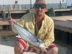 Angler holding a spanish mackerel fish caught in NC