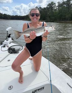 Angler holding a spotted weakfish, Cedar Point