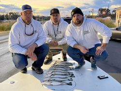 Three people enjoying a fishing trip in NC