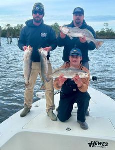 Three spotted weakfish measuring 18 inches caught while fishing at Cedar Point