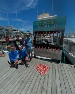 A group of 5 people enjoying a fishing trip in Destin