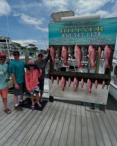 4 people fishing in FL with 4 big fish