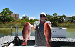 Two grey snapper, 19 inches, caught while fishing in Destin