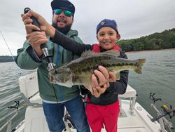 Bass fishing success on lake near Gainesville GA with freshly caught largemouth bass
