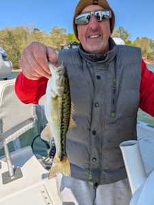 3 people fishing in GA with a 20-inch fish