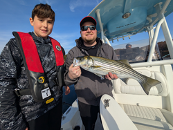 Nice striped bass using jigging and light tackle techniques in clear conditions!