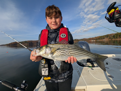 Nice striped bass using jigging and trolling techniques on calm water!