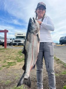 Fisherman with big fish at Gold Beach