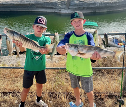 Two striped bass caught by two people in Clifton