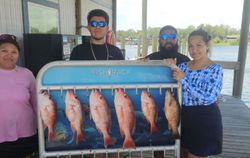 Group of 4 people fishing in Panama City