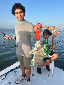 Reeling in a 15-inch Black Drum off South Padre Island!