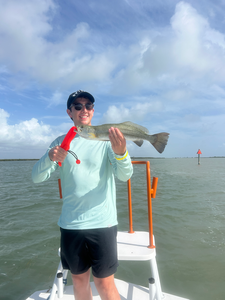 Reeling in the big one on a clear day at South Padre Island!