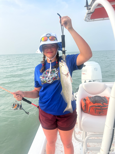 Reeling in the catch of the day in the sunny South Padre waters!