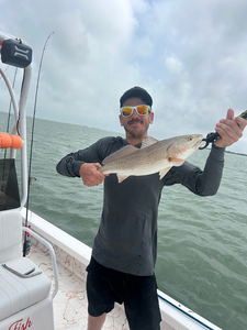 Landed a feisty redfish on a day with cloudy skies!