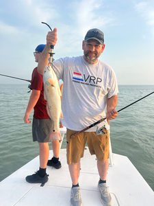 Hooked a feisty Redfish during the perfect partly cloudy day on the water!