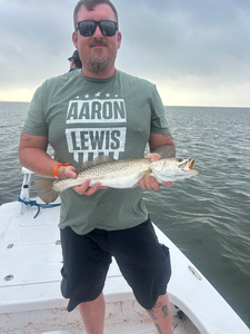 Relaxing by the water with a catch of the day.