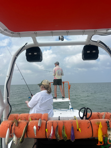 Spending a relaxing day by the water, reeling in some good ones.