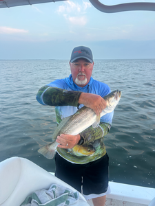 Great catch using deep sea jigging techniques! Partly cloudy conditions made for perfect fishing weather.