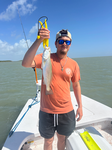 Reeled in a feisty spotted weakfish while deep sea jigging with light tackle off the coast of South Padre Island!