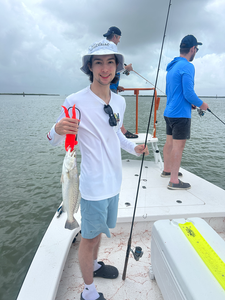 Just landed a feisty Spotted Weakfish on a day with strong storms in the forecast!