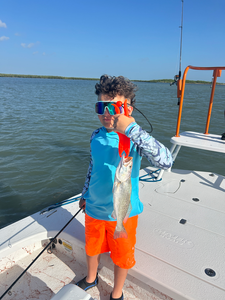A spotted weakfish caught with a deep sea jigging technique in the clear waters of South Padre Island, Texas.