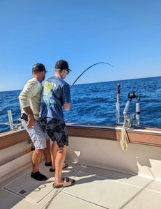 Two people fishing in MI