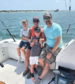 Fishing charter boat with fishing rods and equipment on water near Morehead City NC
