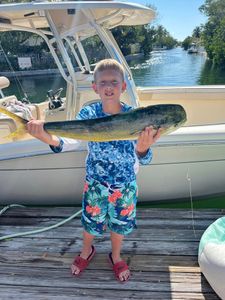 A person holding a fishing rod in Florida