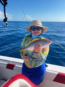 Angler holding a 15-inch fish in FL