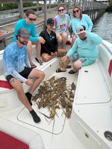 5 people fishing on the beach in Florida