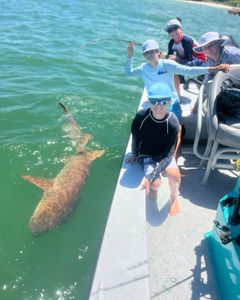 4 people having fun fishing and doing water sports in FL