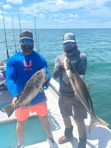 Two people fishing in the water in FL