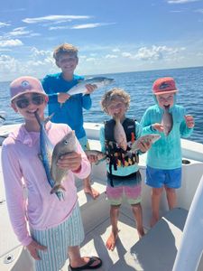 5 people fishing and enjoying water sports in Sarasota