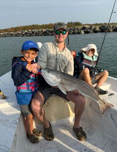 Big Redfish catch on a fun Florida family fishing 
