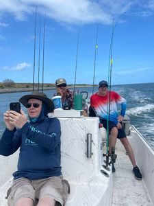 Fishing charter boat with multiple fishing rods set up in Port Canaveral FL waters