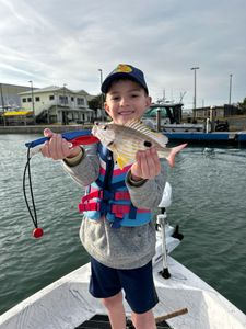 Angler with a small fish caught in FL